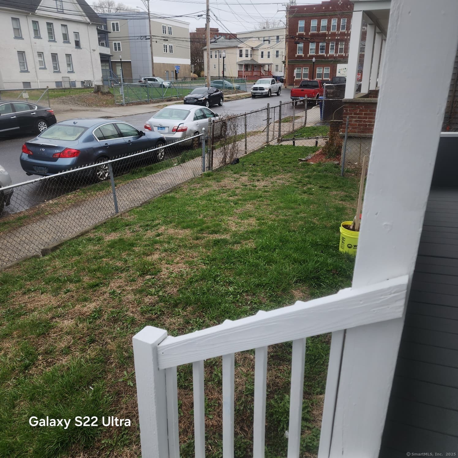 68 Edwin Street Bridgeport, CT 06607 - Photo 20 of 23 a balcony with wooden floor and outdoor seating