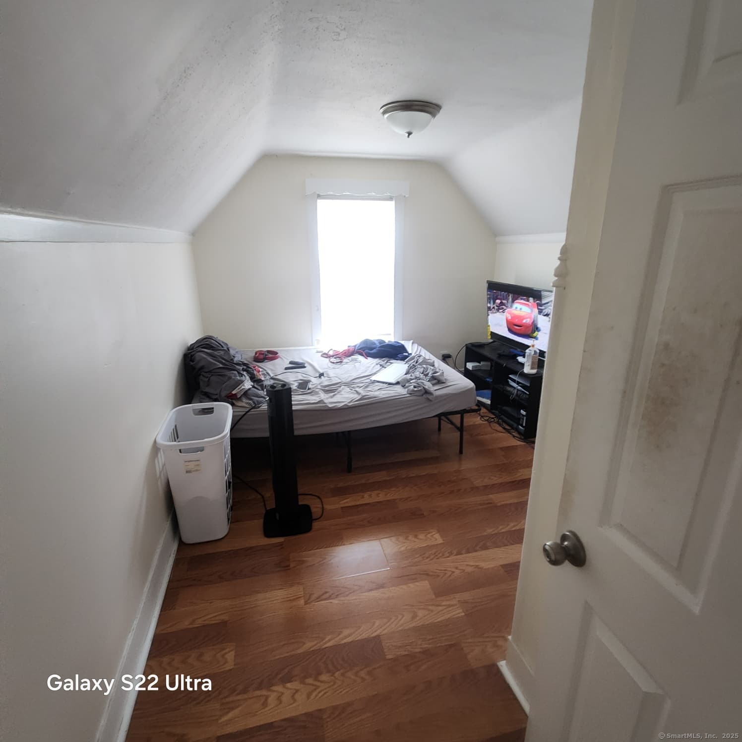 68 Edwin Street Bridgeport, CT 06607 - Photo 9 of 23 a bedroom with a bed and a window