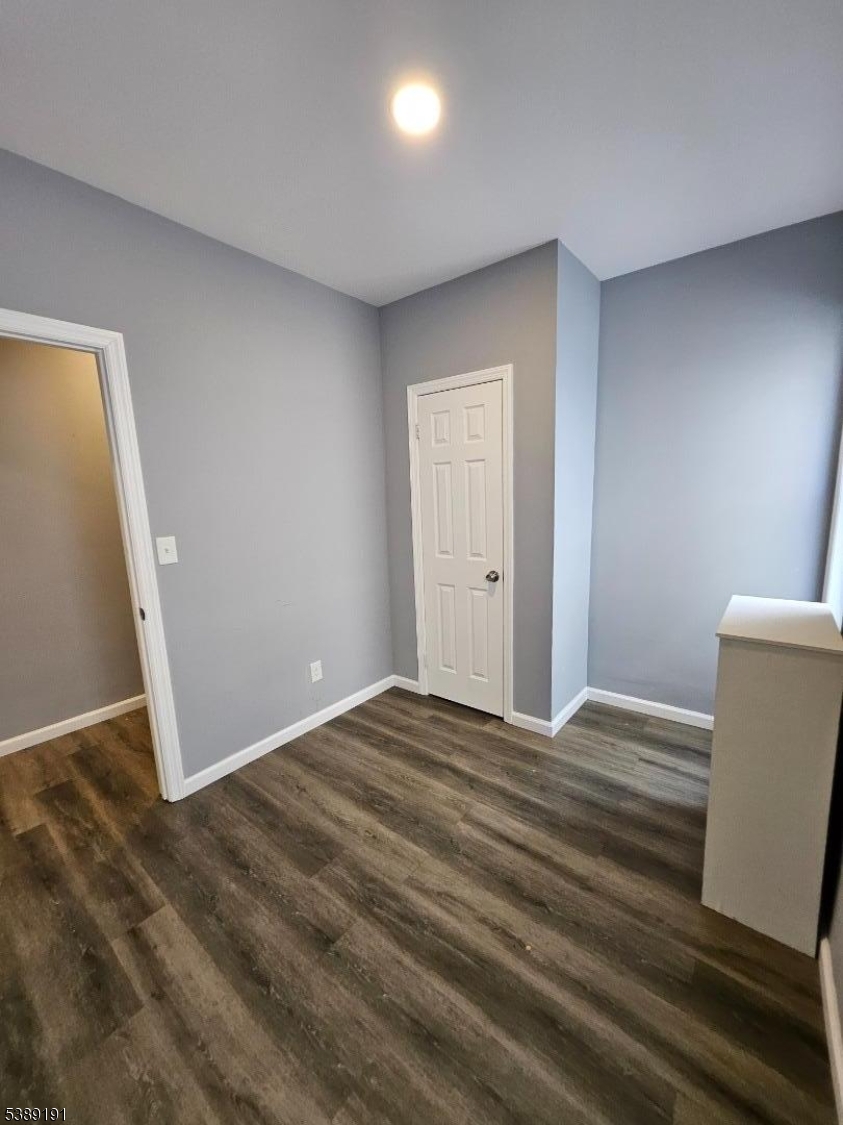 228 West End Avenue Newark, NJ 07106 - Photo 12 of 19 a view of empty room with wooden floor