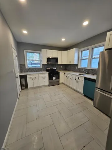 a bathroom with a sink a toilet and bathtub