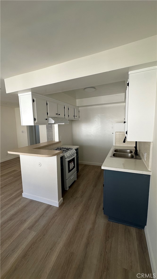 525 Howard Street, Unit E Alhambra, CA 91801 - Photo 3 of 5 a living room with hard wood floors and a couch