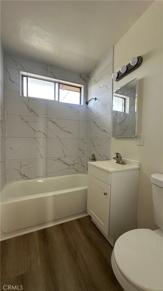 525 Howard Street, Unit E Alhambra, CA 91801 - Photo 4 of 5 a bathroom with a sink a toilet and bathtub