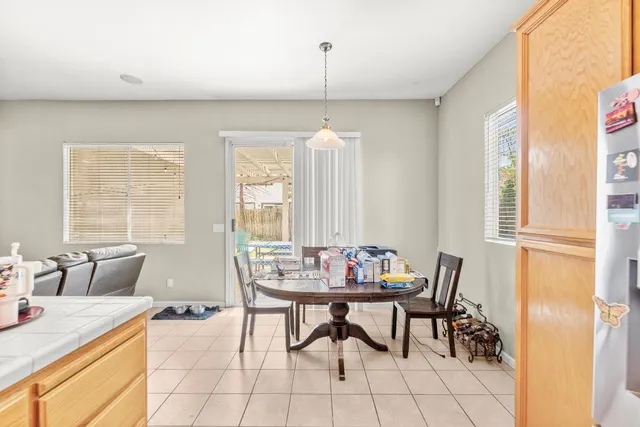 a dining room with furniture and window