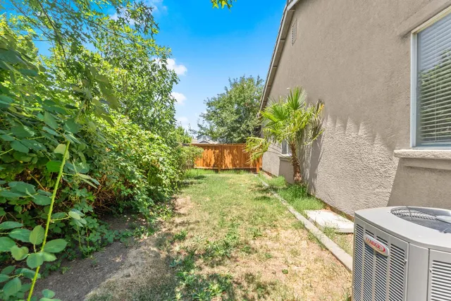 a backyard of a house with outdoor seating