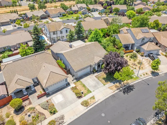 an aerial view of a house with outdoor space