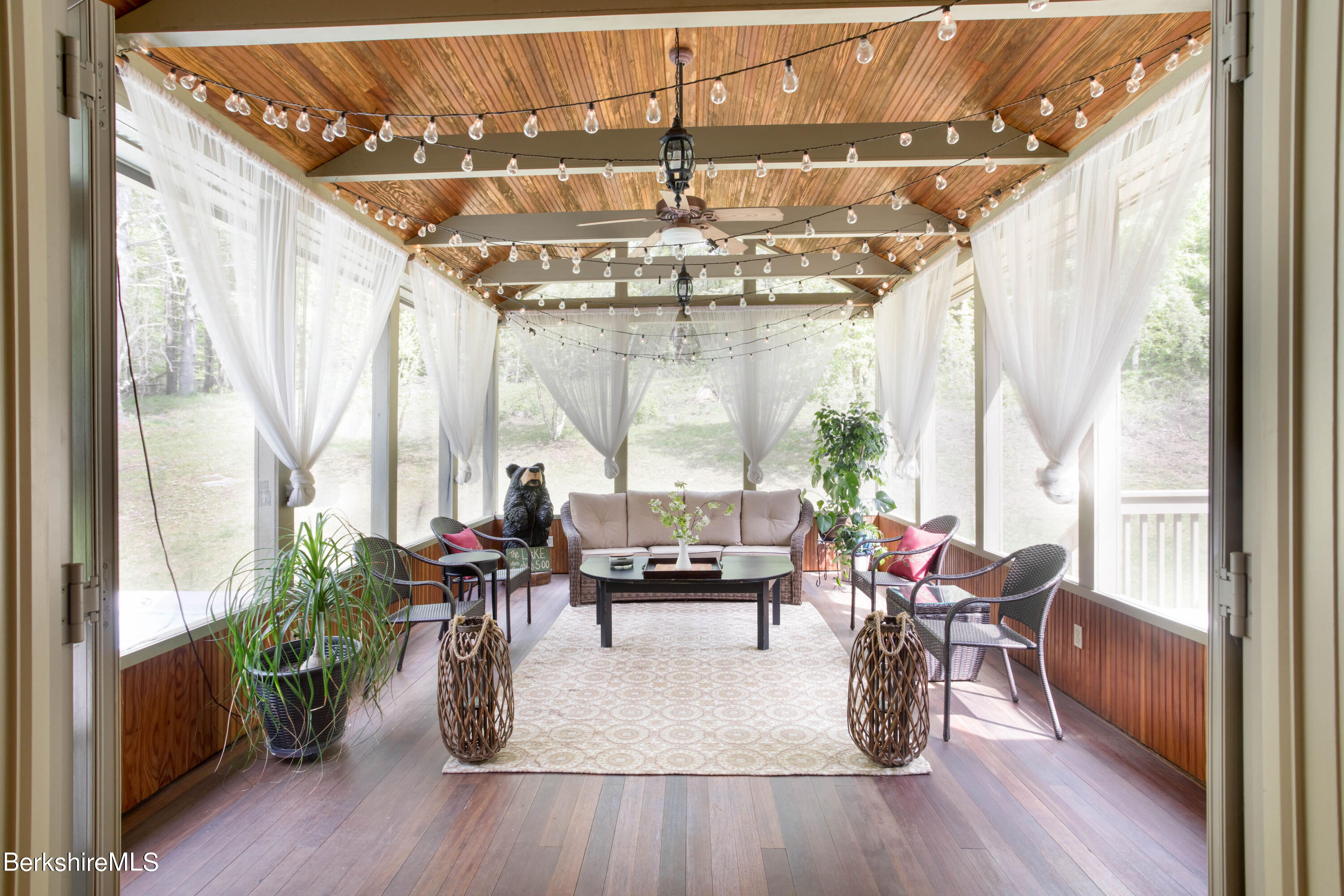357 Twin Lakes Road Salisbury, CT 06068 - Photo 12 of 31 a living room with furniture and a large window