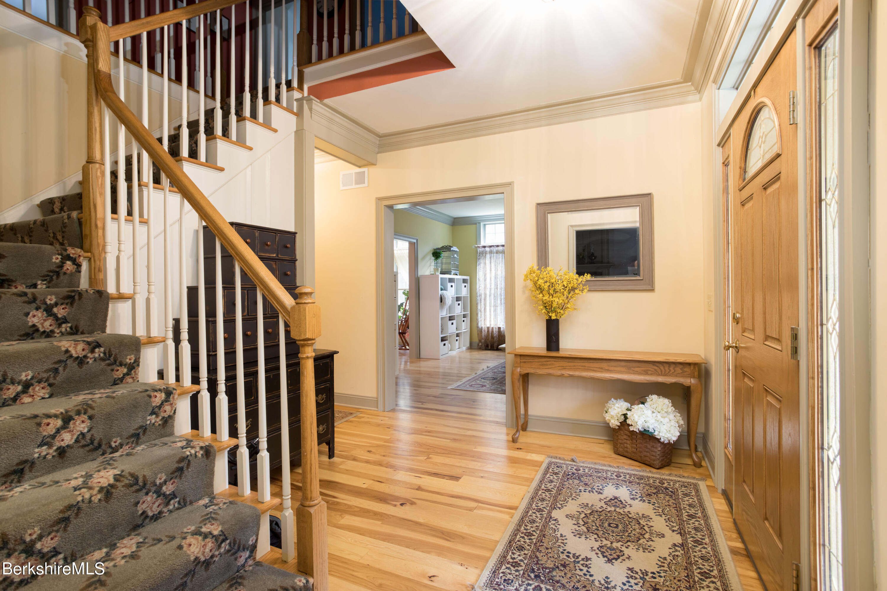 357 Twin Lakes Road Salisbury, CT 06068 - Photo 14 of 31 a view of a hallway with wooden floor and staircase