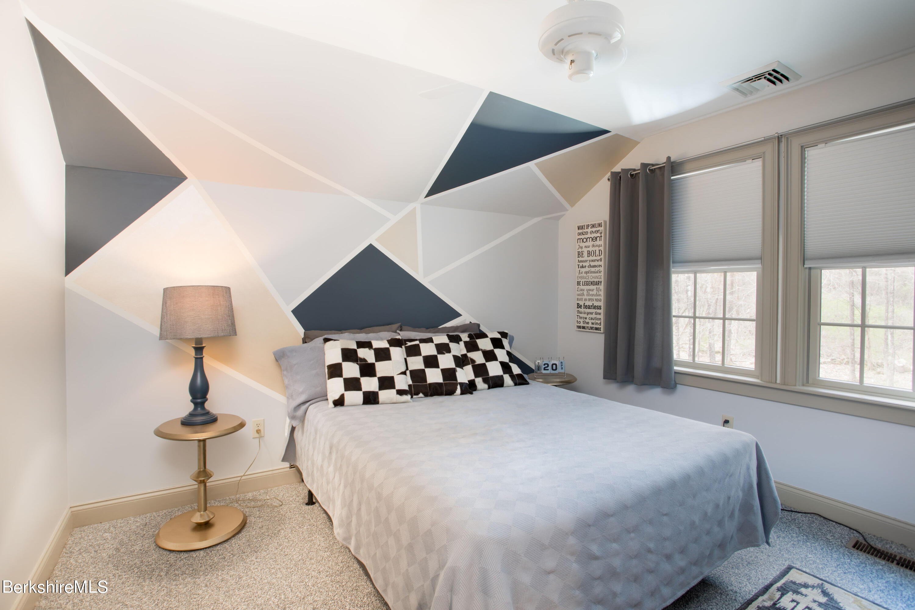 357 Twin Lakes Road Salisbury, CT 06068 - Photo 19 of 31 a bedroom with a bed and a lamp