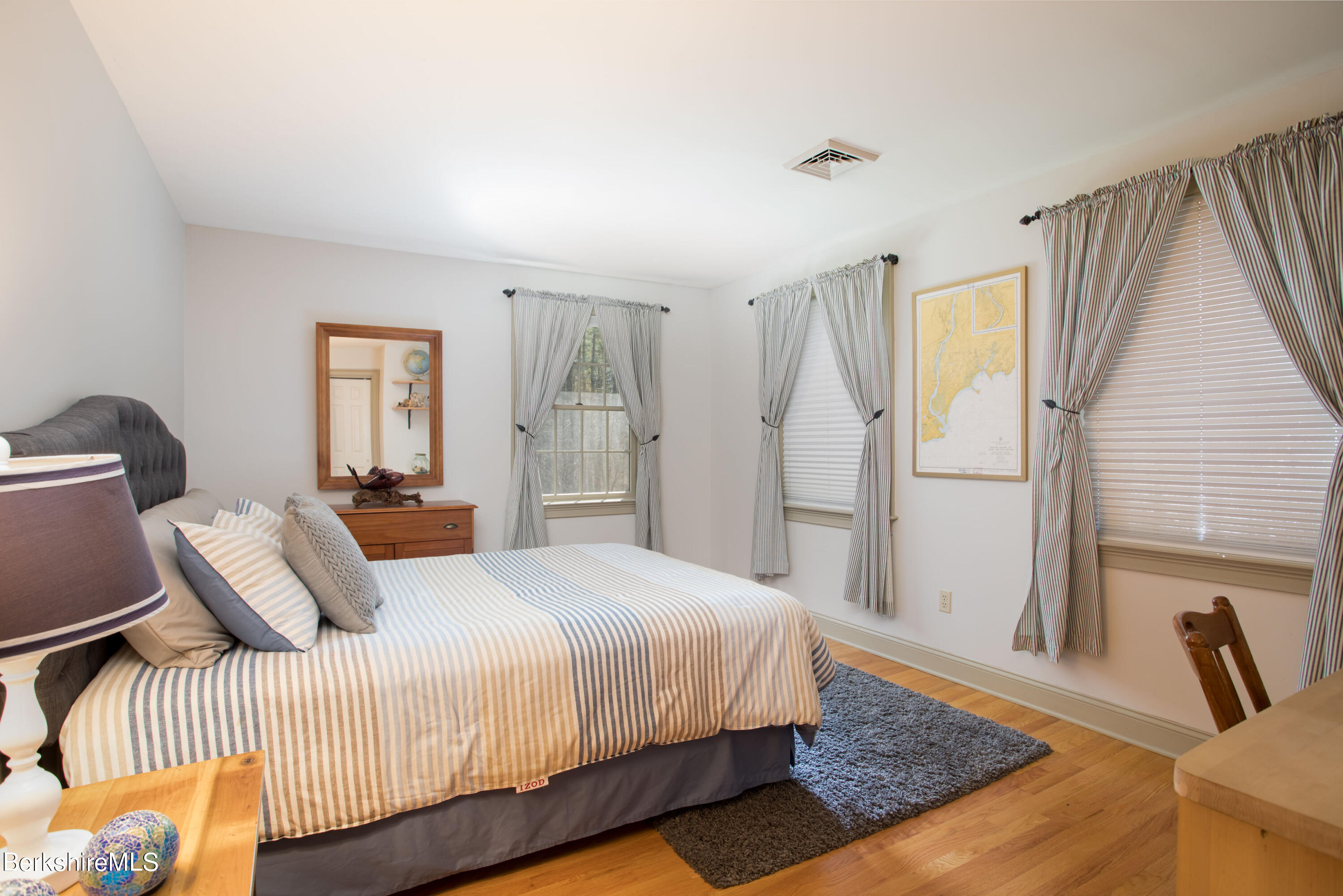 357 Twin Lakes Road Salisbury, CT 06068 - Photo 21 of 31 a bedroom with a bed and a large mirror on the dresser