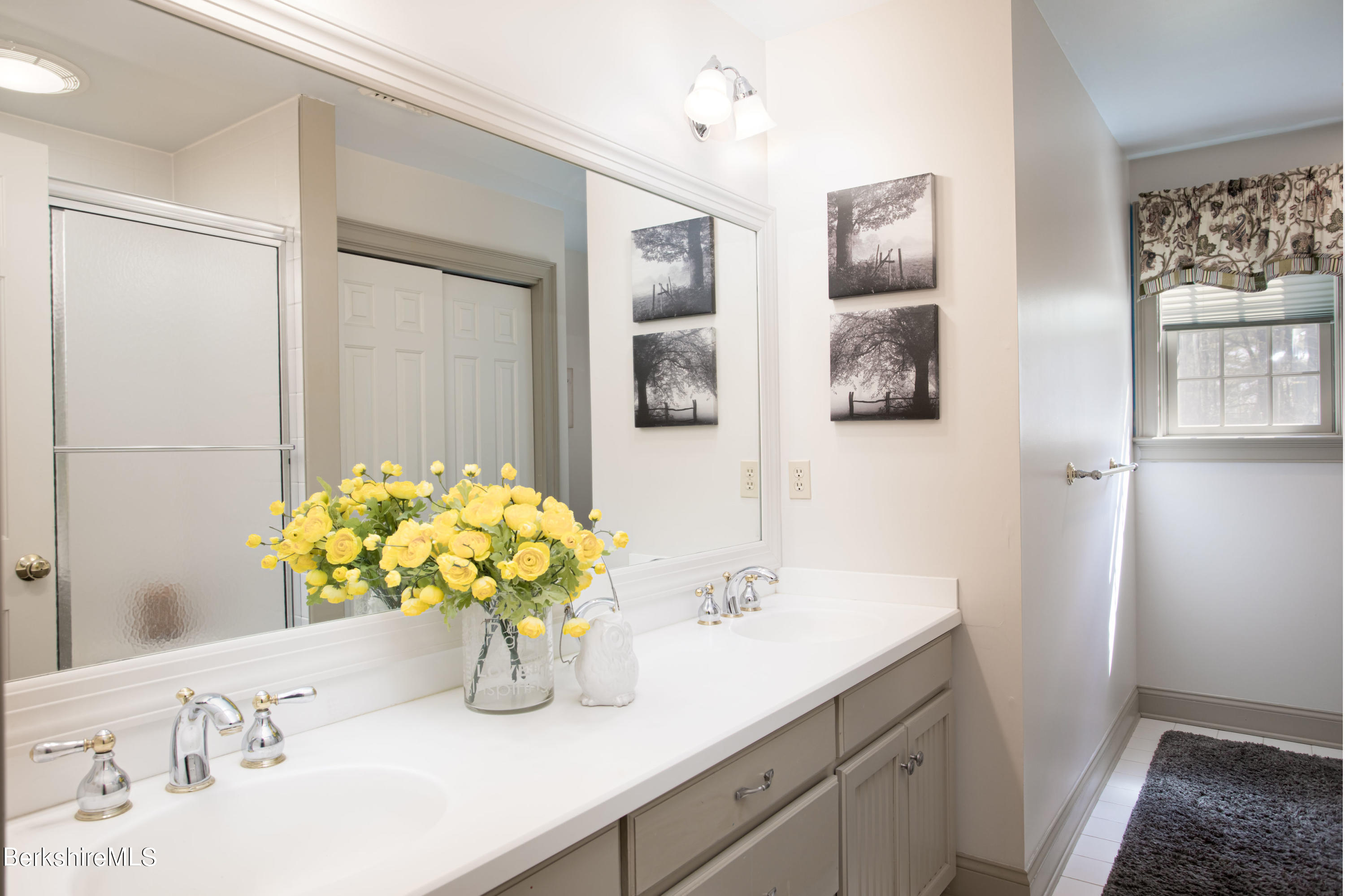 357 Twin Lakes Road Salisbury, CT 06068 - Photo 22 of 31 a bathroom with a sink a vanity and a mirror