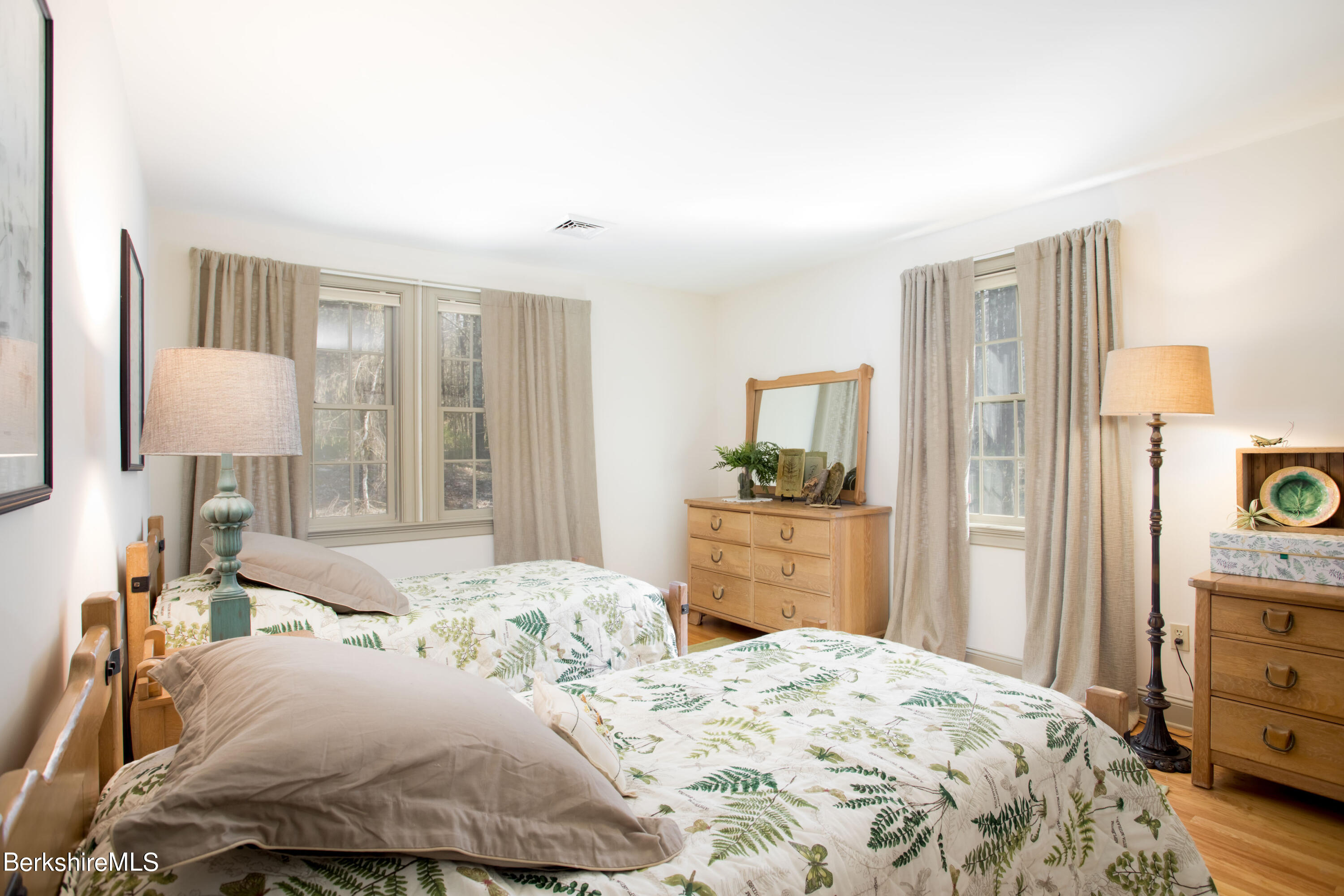 357 Twin Lakes Road Salisbury, CT 06068 - Photo 23 of 31 a bedroom with a bed and wooden floor