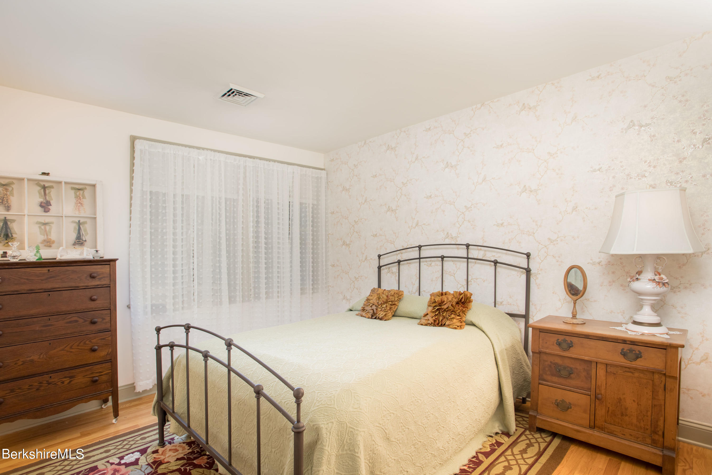357 Twin Lakes Road Salisbury, CT 06068 - Photo 24 of 31 a bedroom with a bed and a dresser
