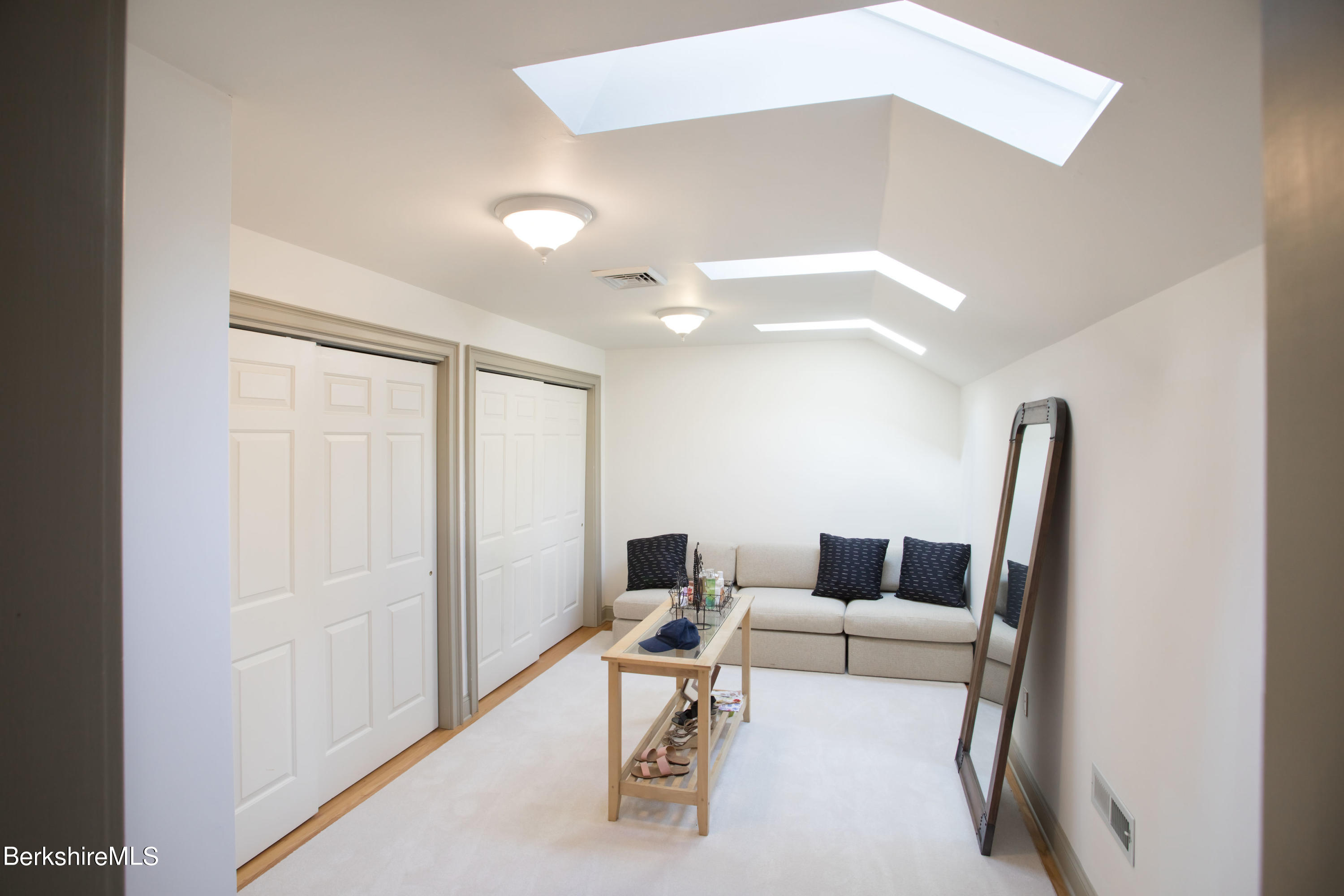 357 Twin Lakes Road Salisbury, CT 06068 - Photo 28 of 31 a living room with furniture and a wooden floor
