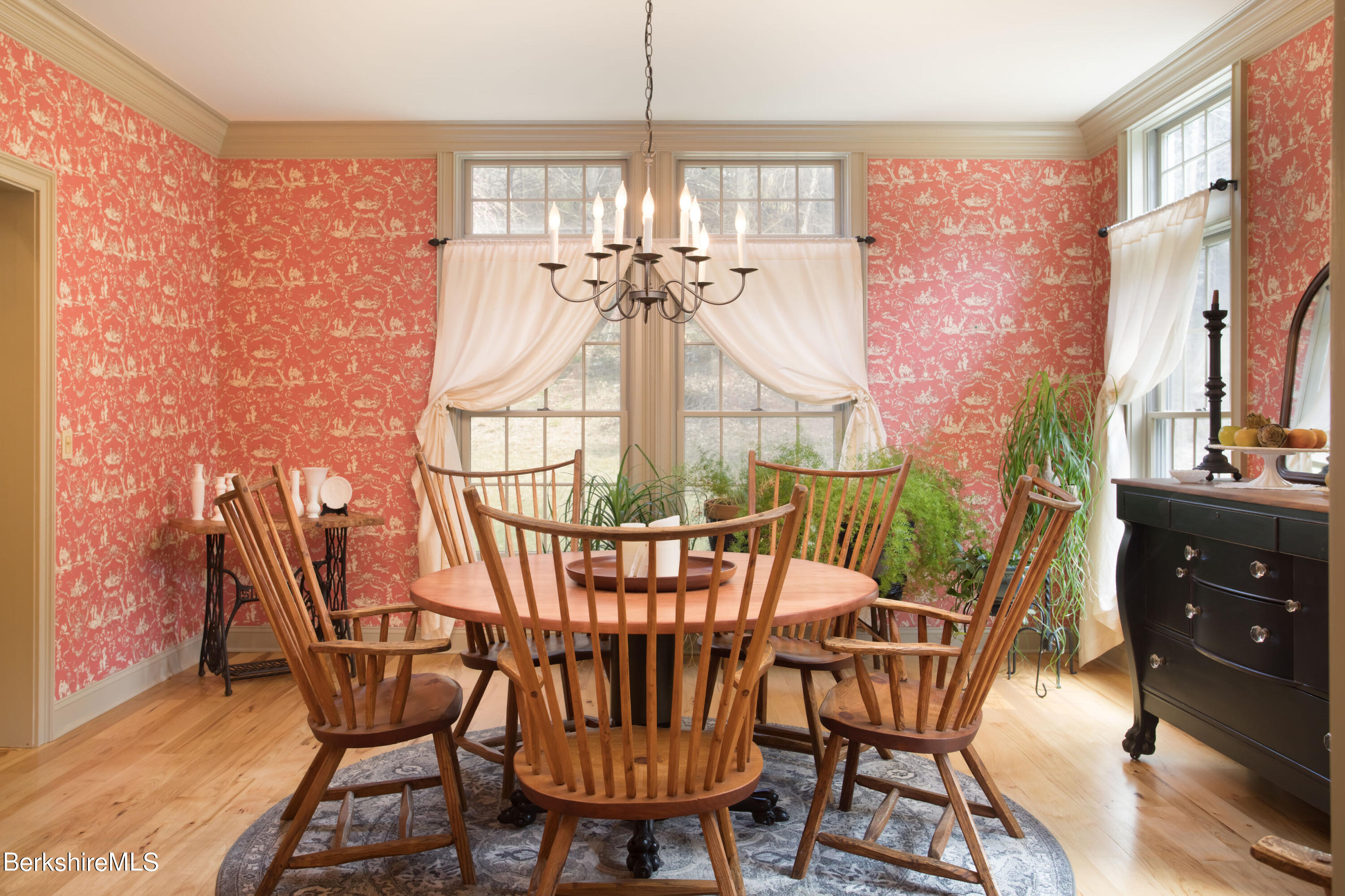 357 Twin Lakes Road Salisbury, CT 06068 - Photo 7 of 31 a view of a dining room with furniture and chandelier
