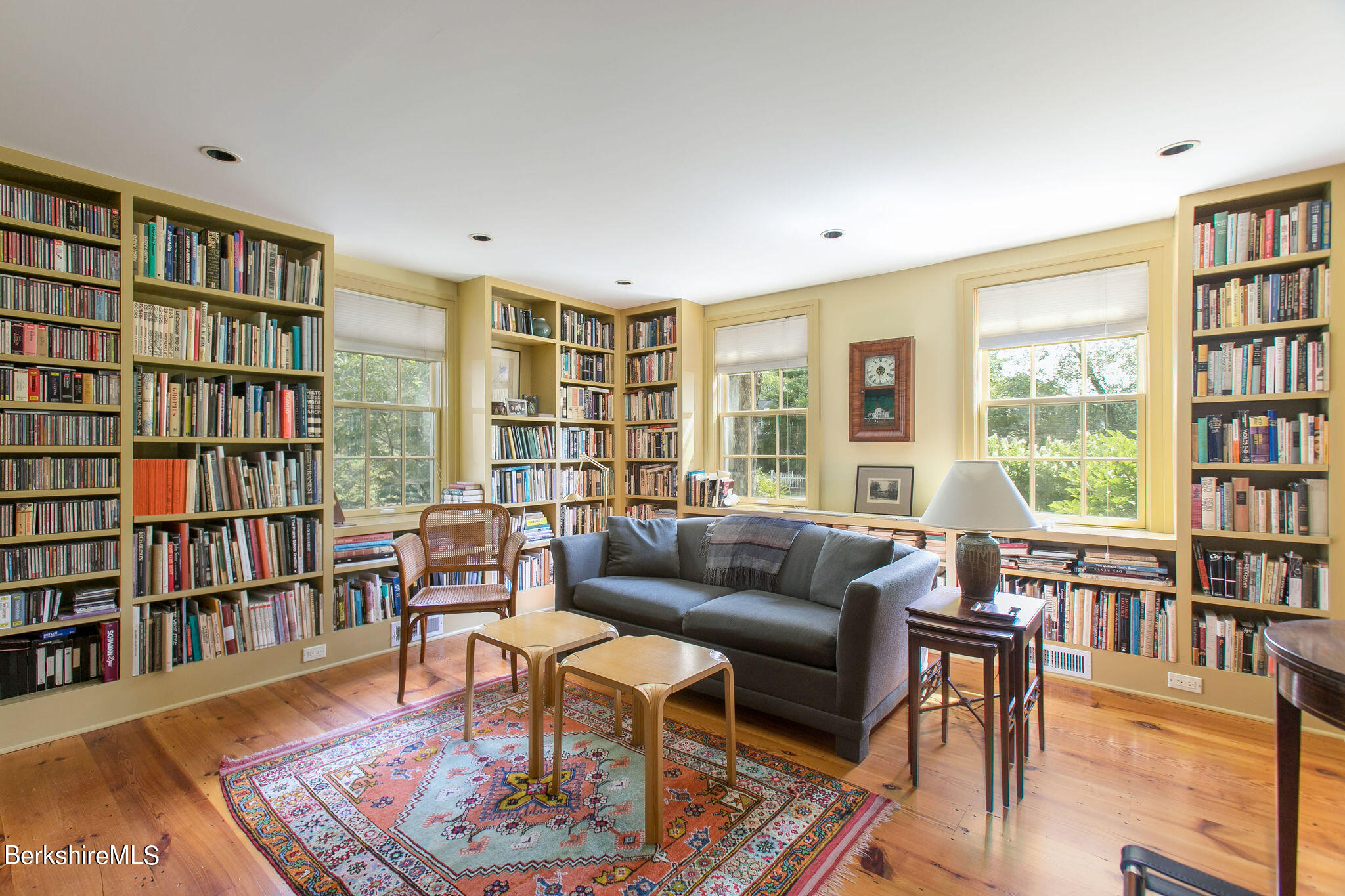 250 East Main Street Sheffield, MA 01222 - Photo 21 of 50 a living room with furniture and a book shelf