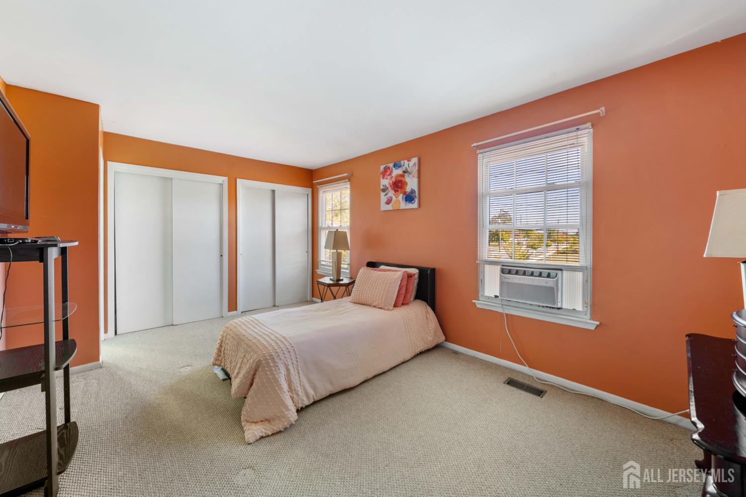 91 Redbud Road Piscataway, NJ 08854 - Photo 5 of 22 a bedroom with a bed and a window