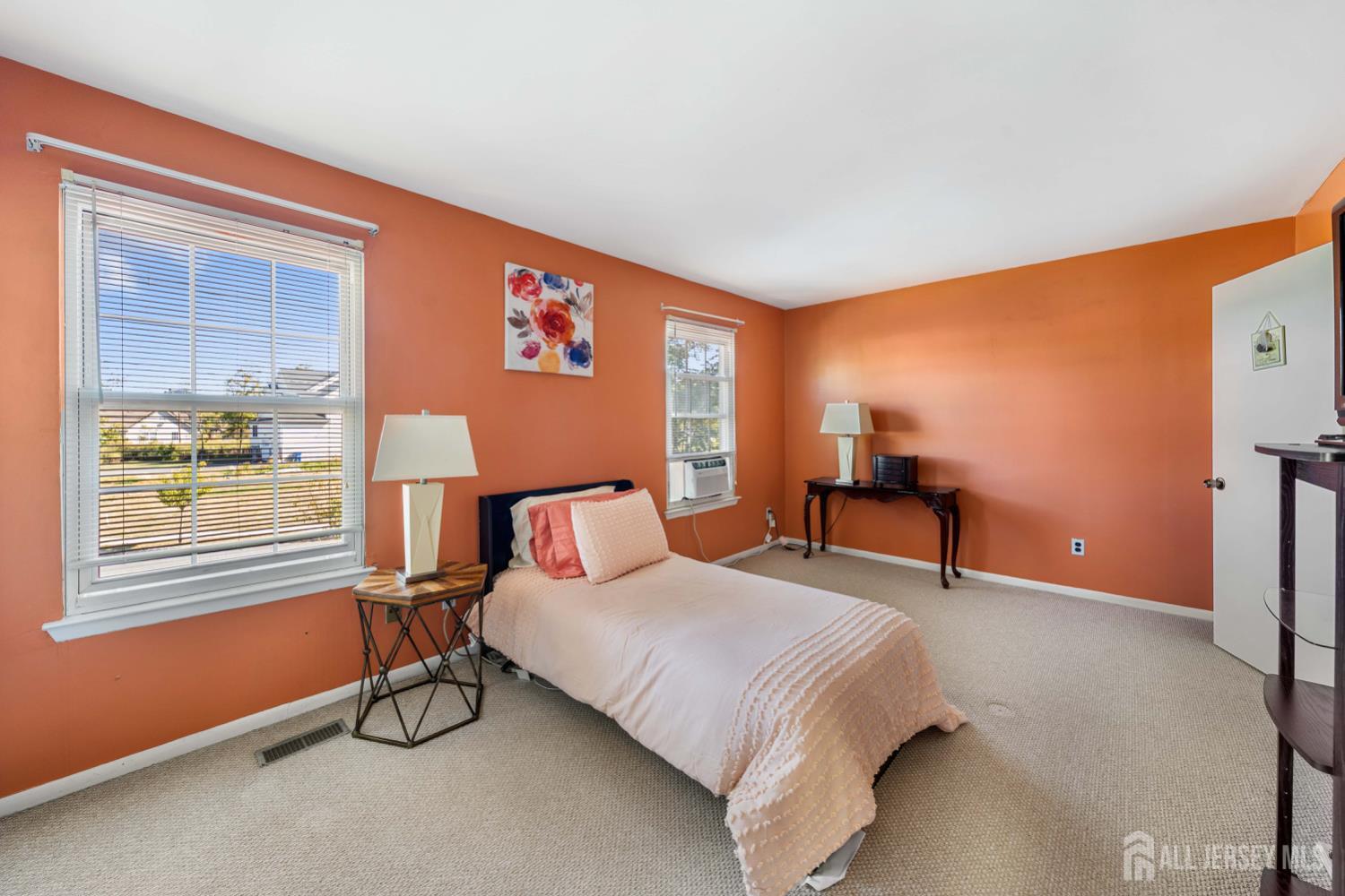 91 Redbud Road Piscataway, NJ 08854 - Photo 6 of 22 a bedroom with a bed and a table in it