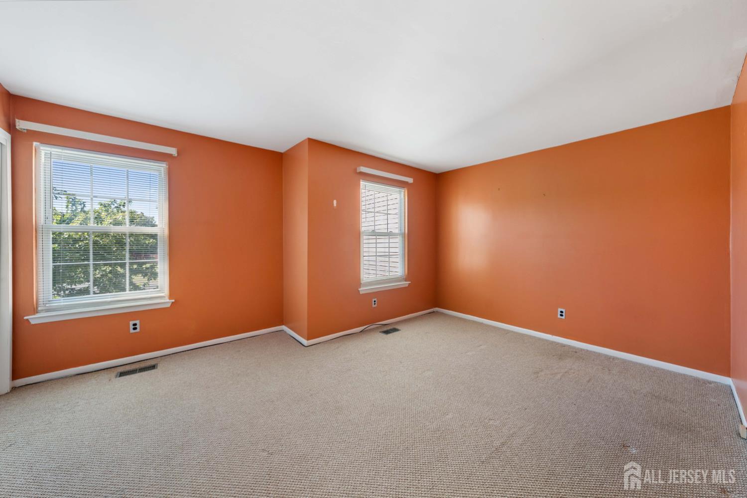 91 Redbud Road Piscataway, NJ 08854 - Photo 8 of 22 an empty room with windows