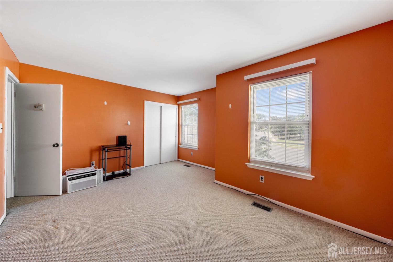 91 Redbud Road Piscataway, NJ 08854 - Photo 9 of 22 an empty room with windows
