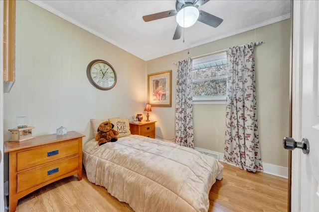 a living room with furniture and flowers