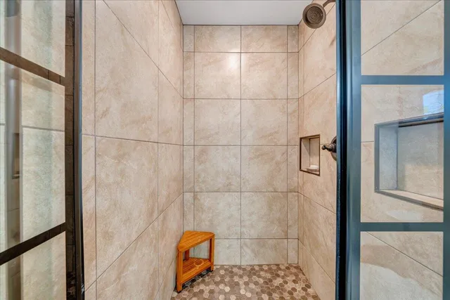 a living room with furniture rug and wooden floor