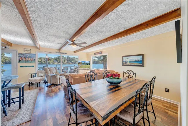 an aerial view of a house with a yard basket ball court and outdoor seating