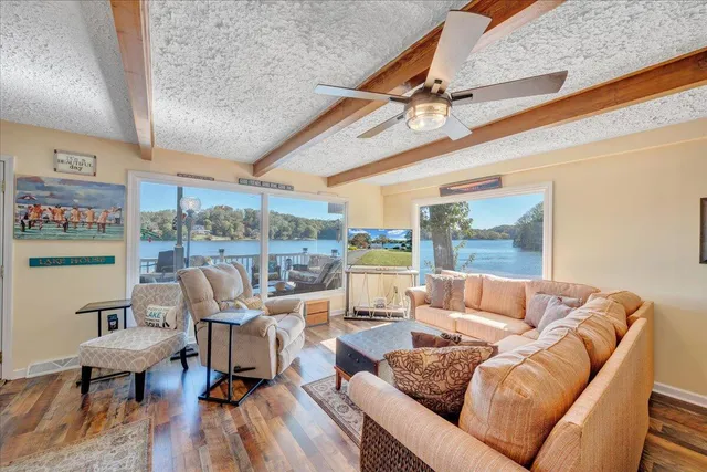 a kitchen with a sink a stove and a clock