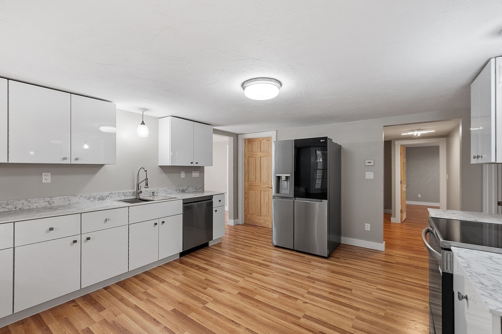 34 Morse Road Royalston, MA 01368 - Photo 1 of 42 a large kitchen with stainless steel appliances granite countertop a stove and a refrigerator