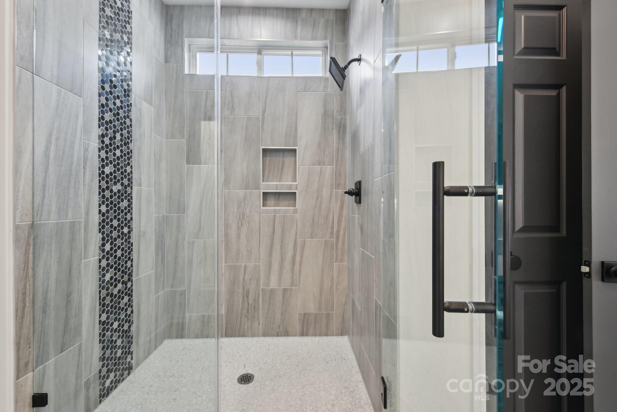 529 Veloce Trail Fort Mill, SC 29715 - Photo 12 of 40 a bathroom with a shower and a tub