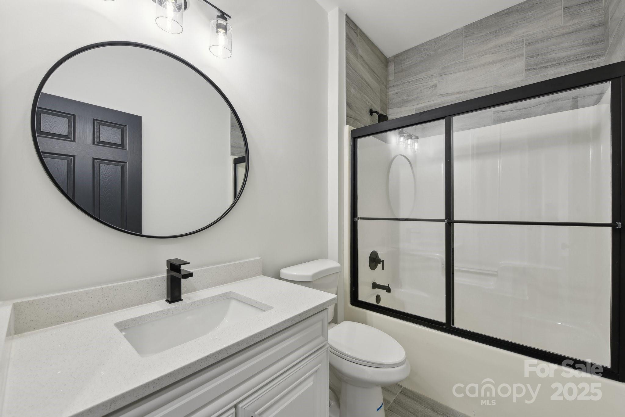 529 Veloce Trail Fort Mill, SC 29715 - Photo 31 of 40 a bathroom with a sink a toilet and a mirror