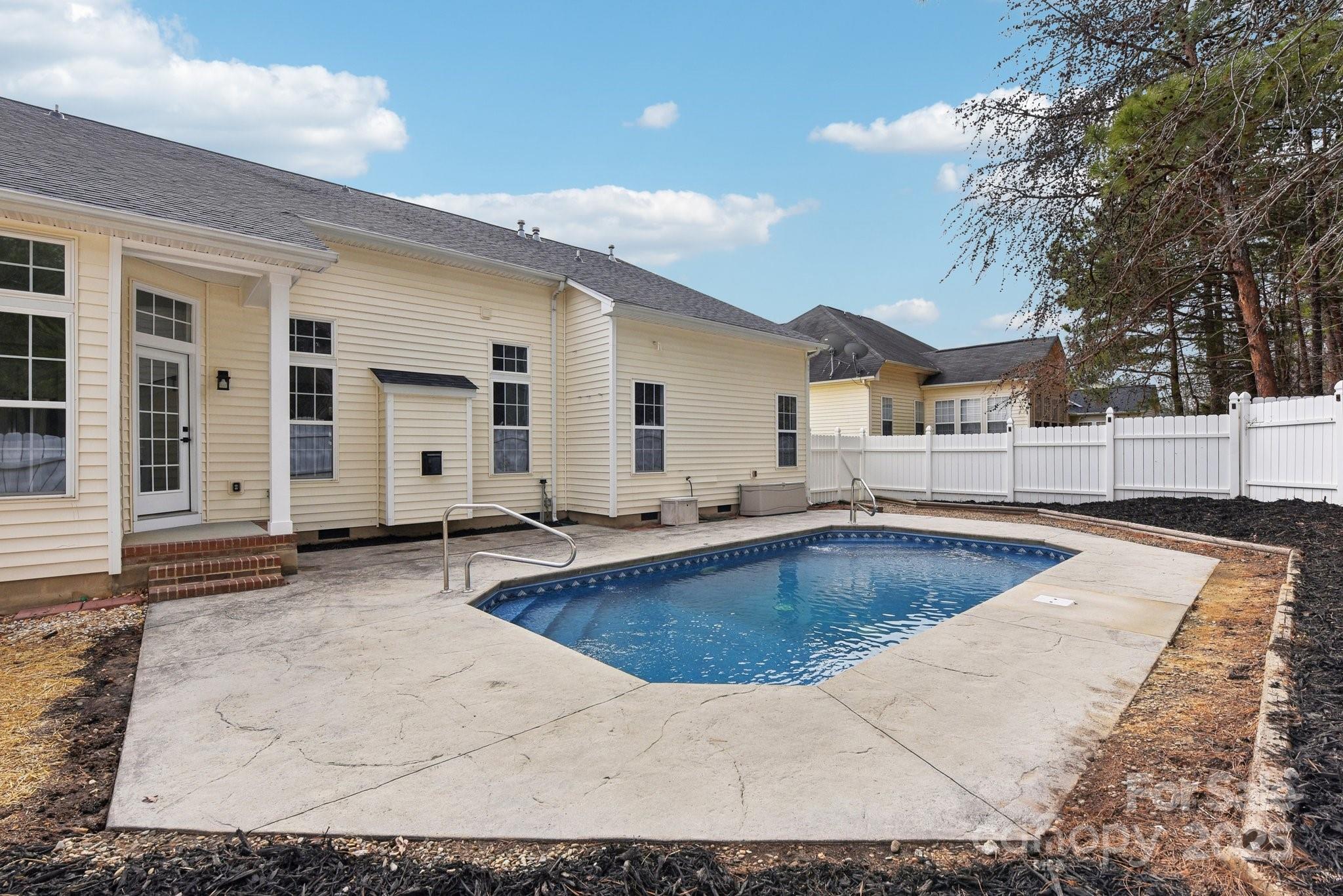 529 Veloce Trail Fort Mill, SC 29715 - Photo 4 of 40 a view of a kitchen with swimming pool and furniture