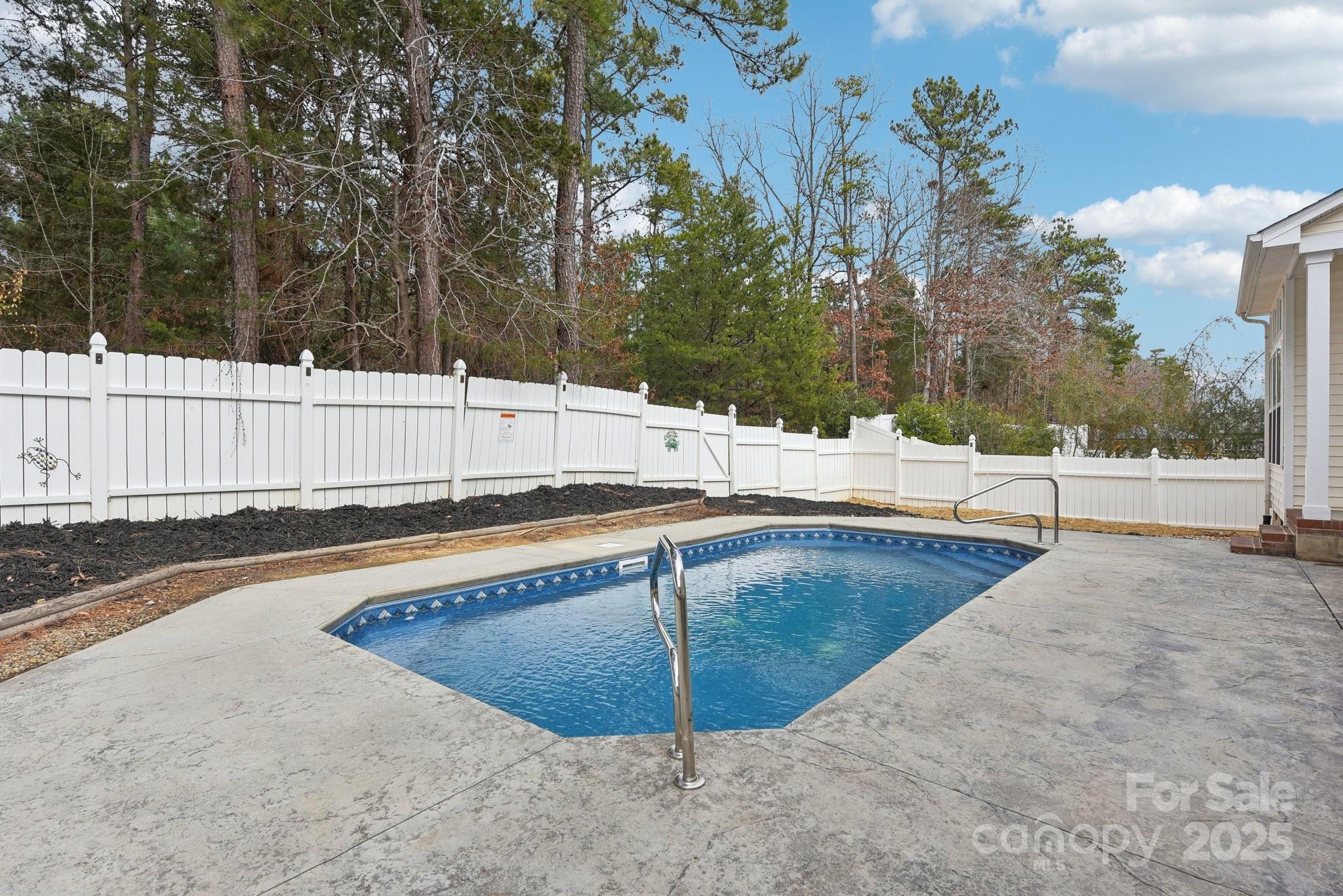 529 Veloce Trail Fort Mill, SC 29715 - Photo 5 of 40 a view of a swimming pool with a patio