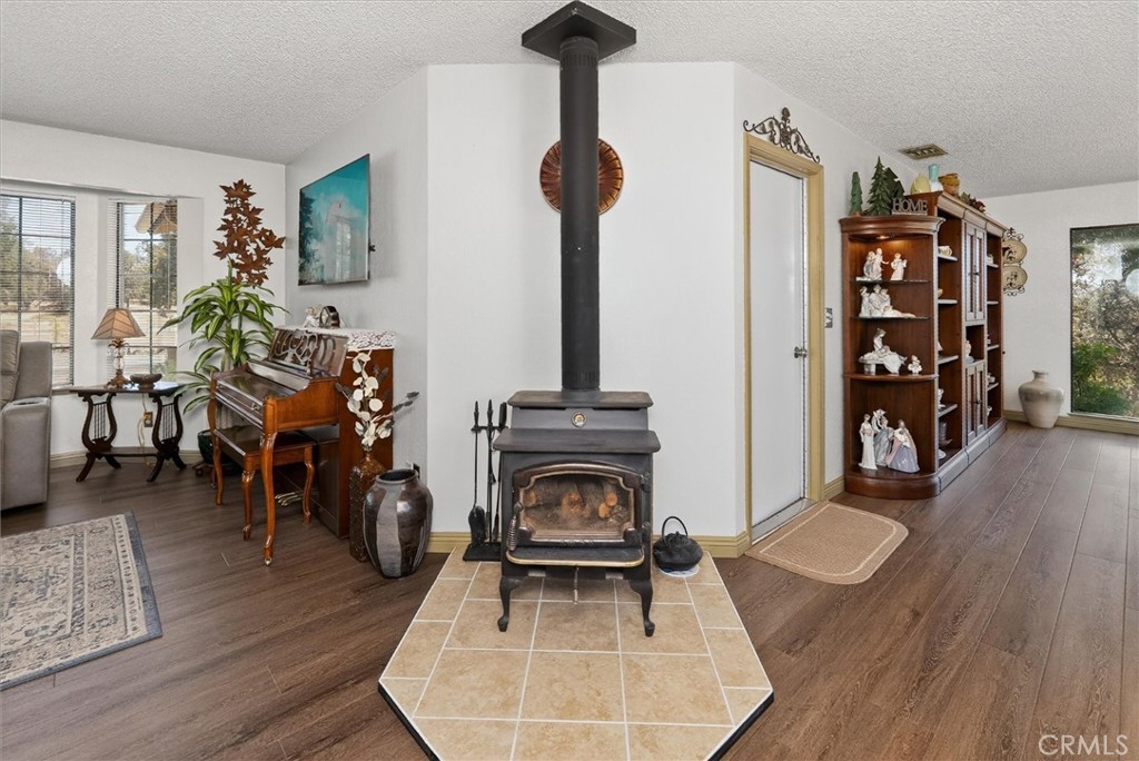 4870 Streeter Mountain Road Mariposa, CA 95338 - Photo 11 of 45 a living room with furniture and wooden floor