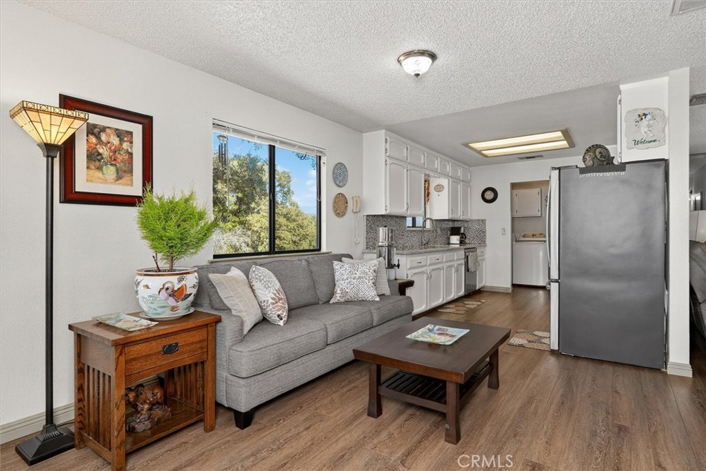 4870 Streeter Mountain Road Mariposa, CA 95338 - Photo 14 of 45 a living room with furniture and a window