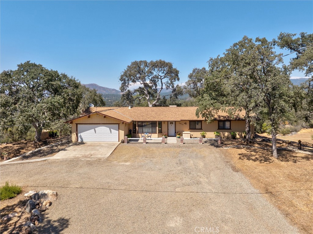 4870 Streeter Mountain Road Mariposa, CA 95338 - Photo 2 of 45 a view of a house with a yard and large tree