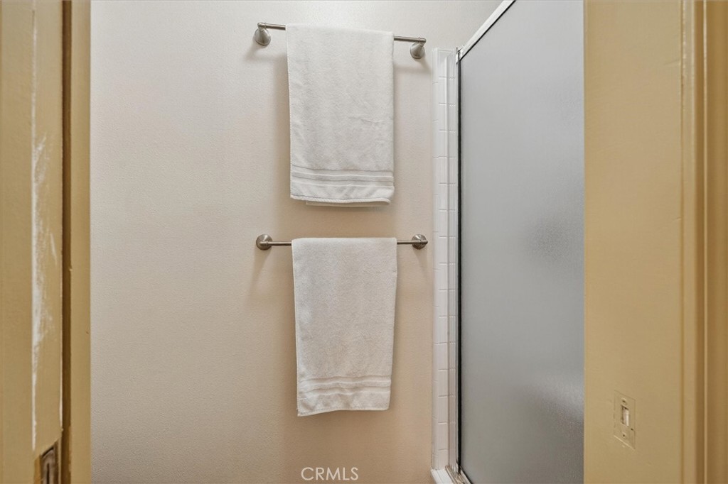 4870 Streeter Mountain Road Mariposa, CA 95338 - Photo 24 of 45 a bathroom with a glass shower door