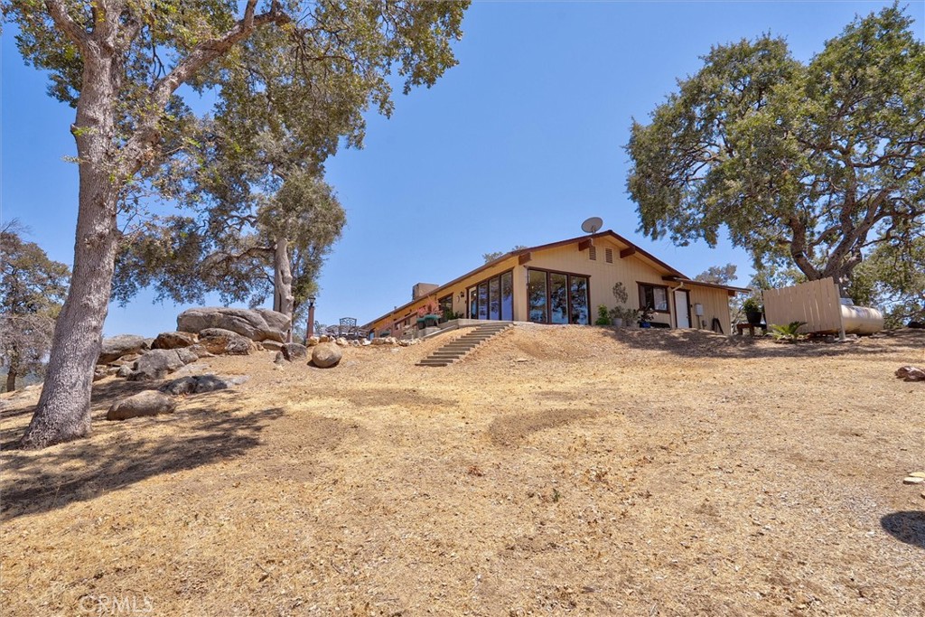 4870 Streeter Mountain Road Mariposa, CA 95338 - Photo 30 of 45 a front view of house with yard covered in snow