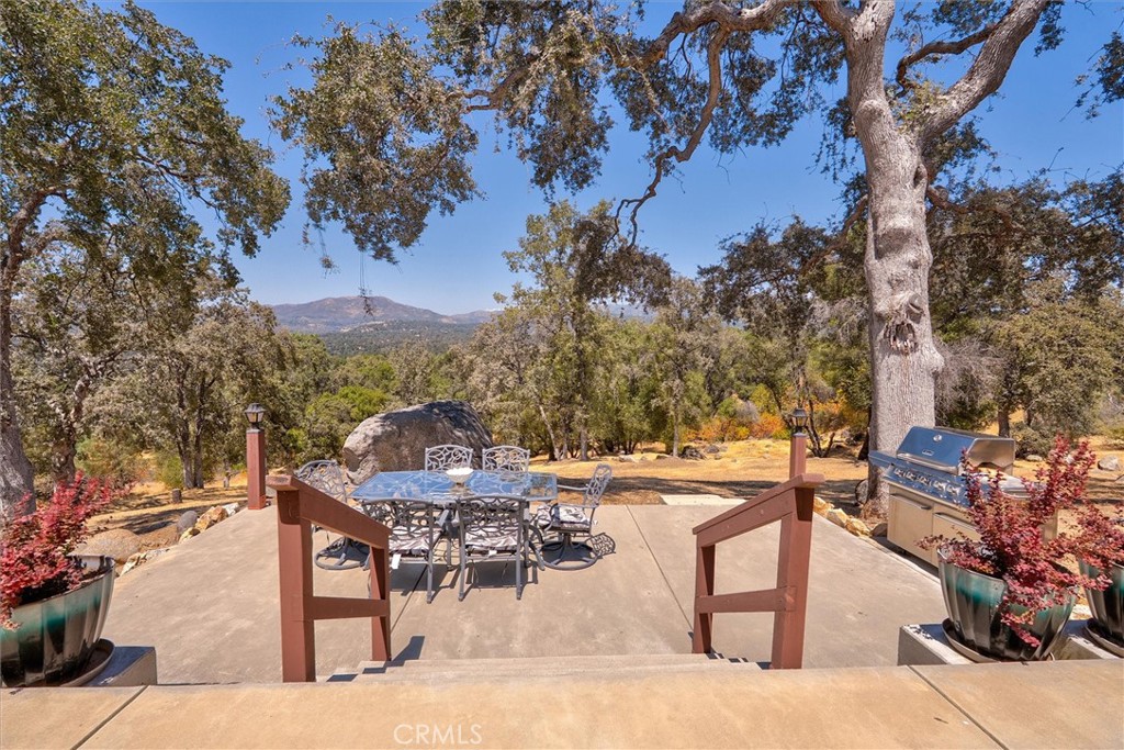 4870 Streeter Mountain Road Mariposa, CA 95338 - Photo 33 of 45 a view of a backyard with sitting area