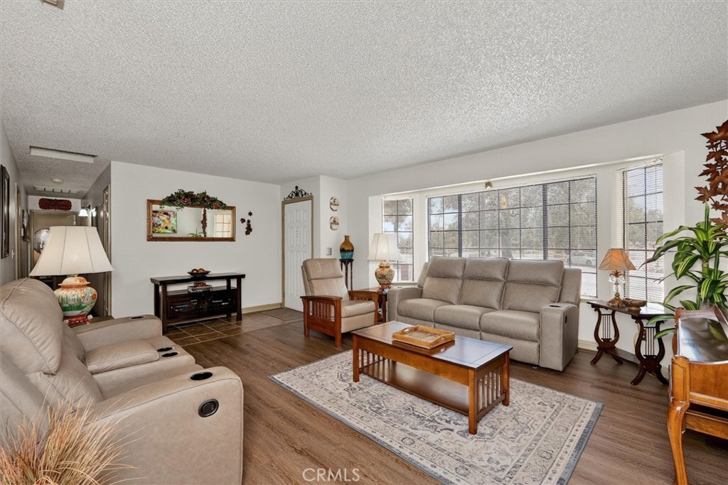 4870 Streeter Mountain Road Mariposa, CA 95338 - Photo 8 of 45 a living room with furniture and a large window