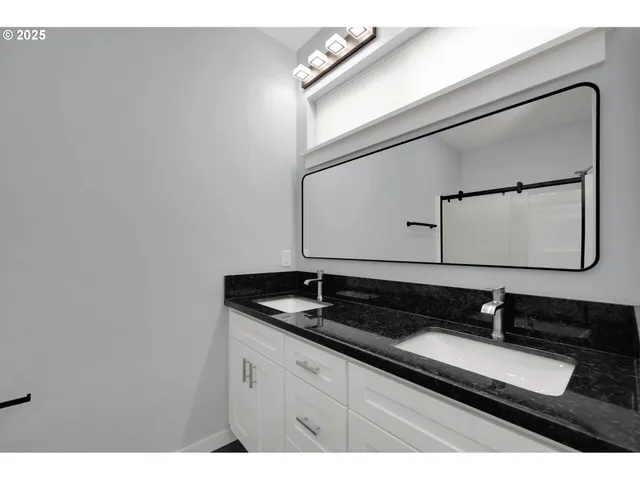 a view of a sink and mirror