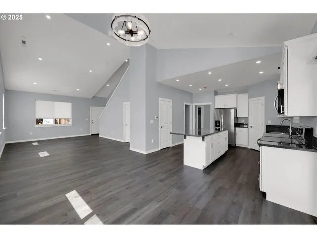 a view of kitchen with cabinets and wooden floor
