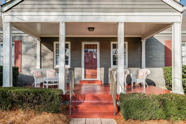 a view of a building with outdoor seating