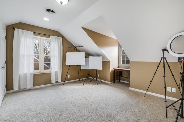 a view of a livingroom with furniture and a window
