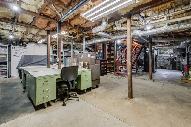 a view of a storage room with a table and chairs
