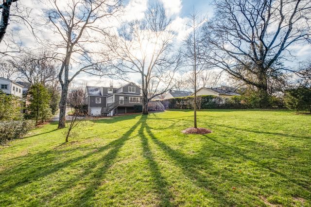 a view of yard with swimming pool