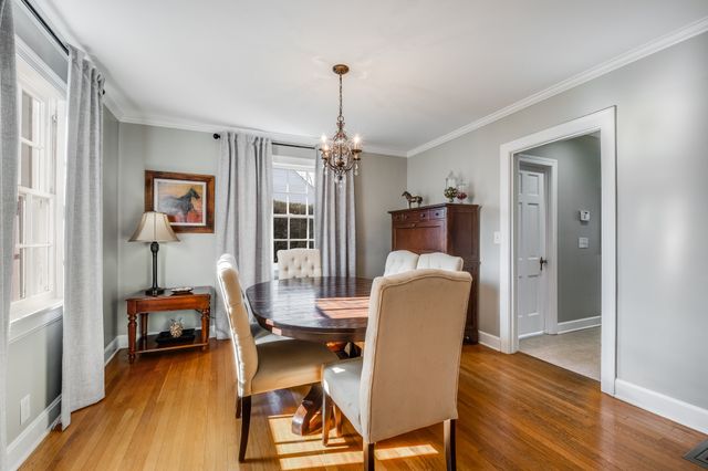 a work room with furniture and wooden floor