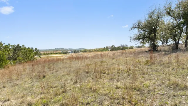a view of lake with green space