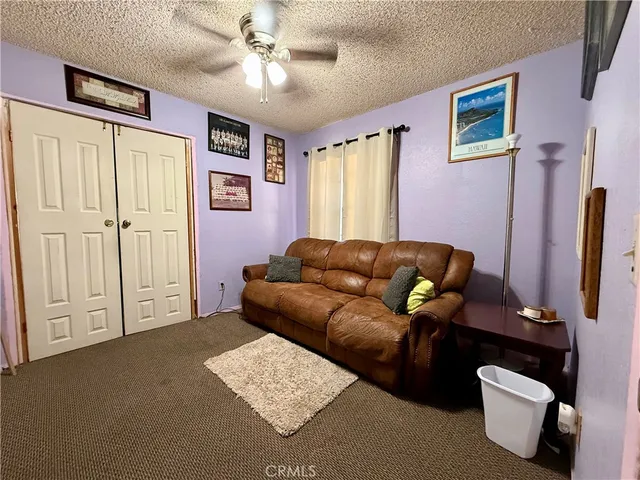 a bedroom with bed and a window