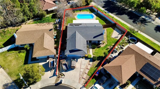 an aerial view of a house with a yard and staircase