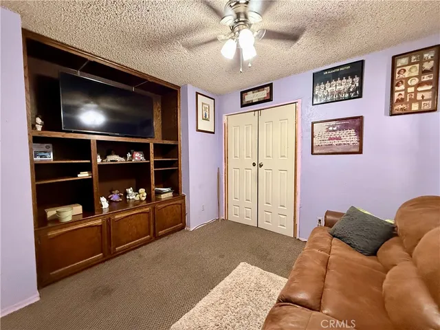 a bedroom with bed and furniture